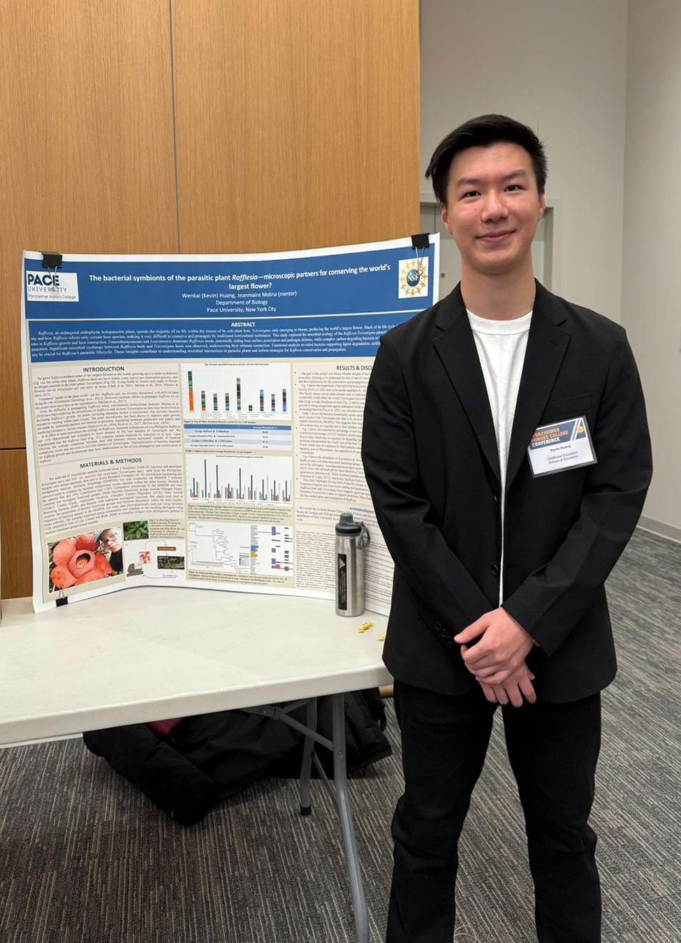 Pace University Biology student Kevin Huang with poster presentation
