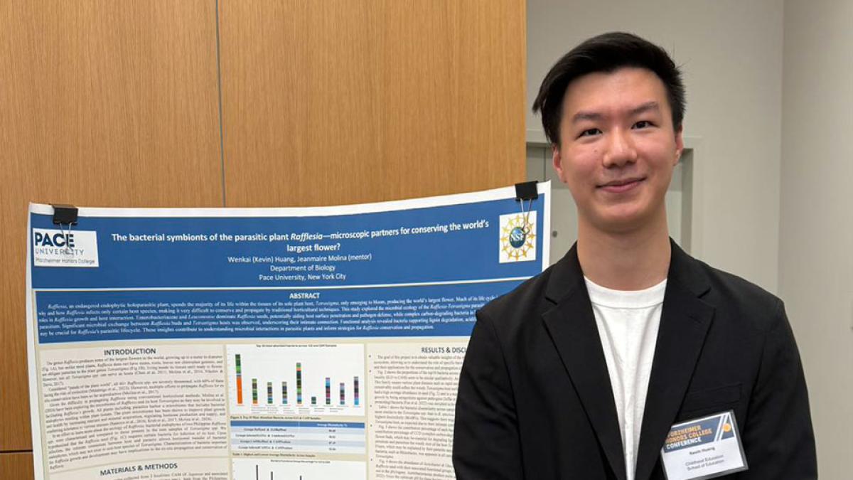 Pace University Biology student Kevin Huang with poster presentation