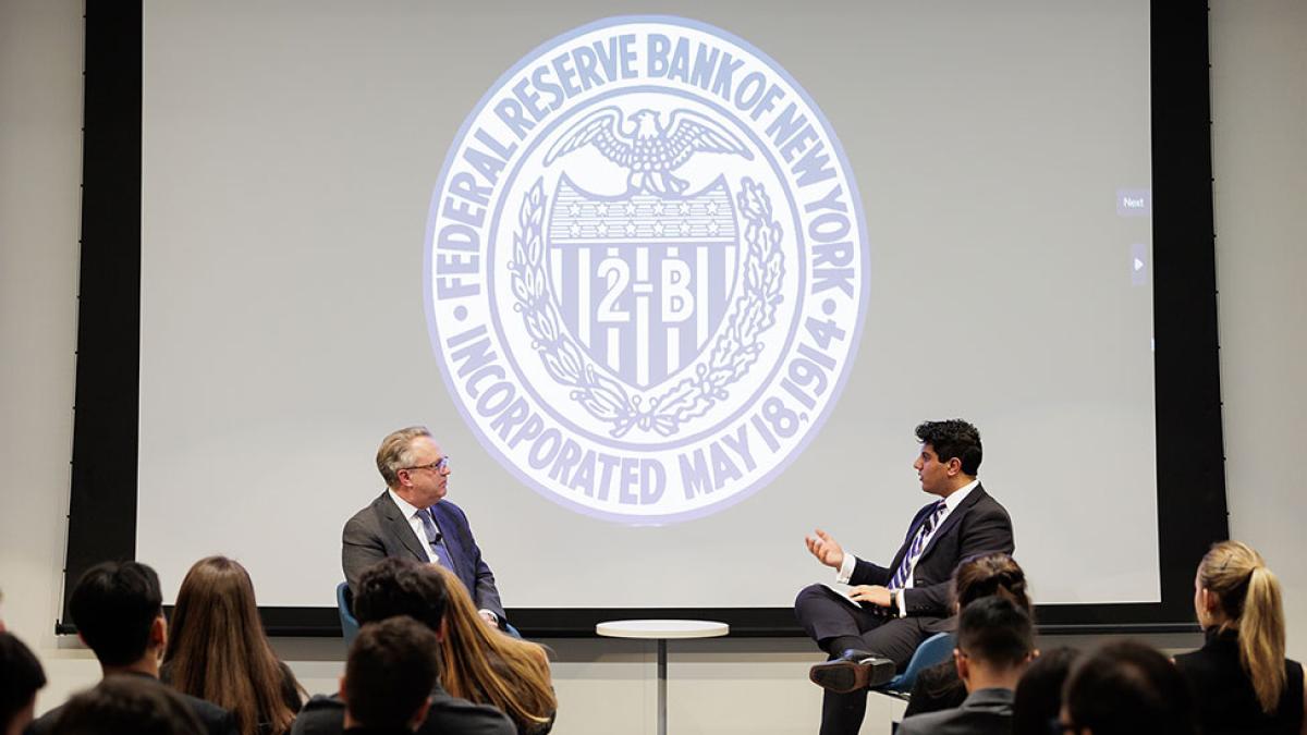 President of the Federal Reserve Bank of New York, John Williams, speaking on stage with Pace University College Federal Reserve Challenge team co-captain and Economics student Suraj Sharma