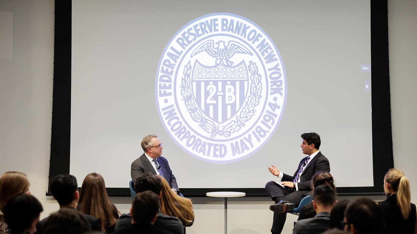 President of the Federal Reserve Bank of New York, John Williams, speaking on stage with Pace University College Federal Reserve Challenge team co-captain and Economics student Suraj Sharma